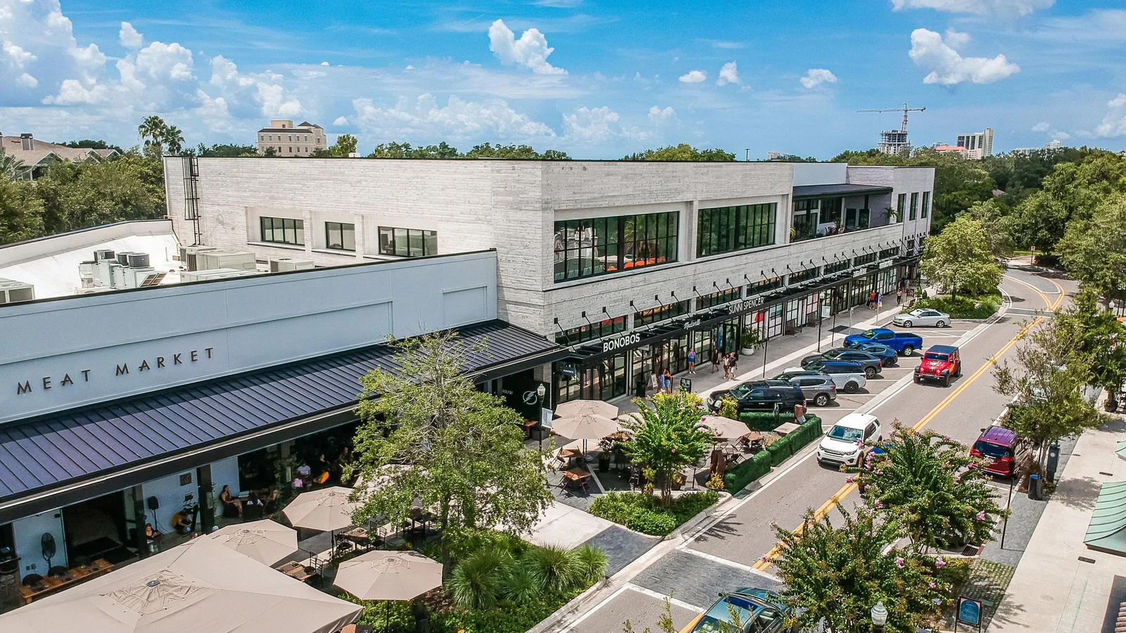 Aerial view of shops and a tree-lined street in Hyde Park Village, Tampa.