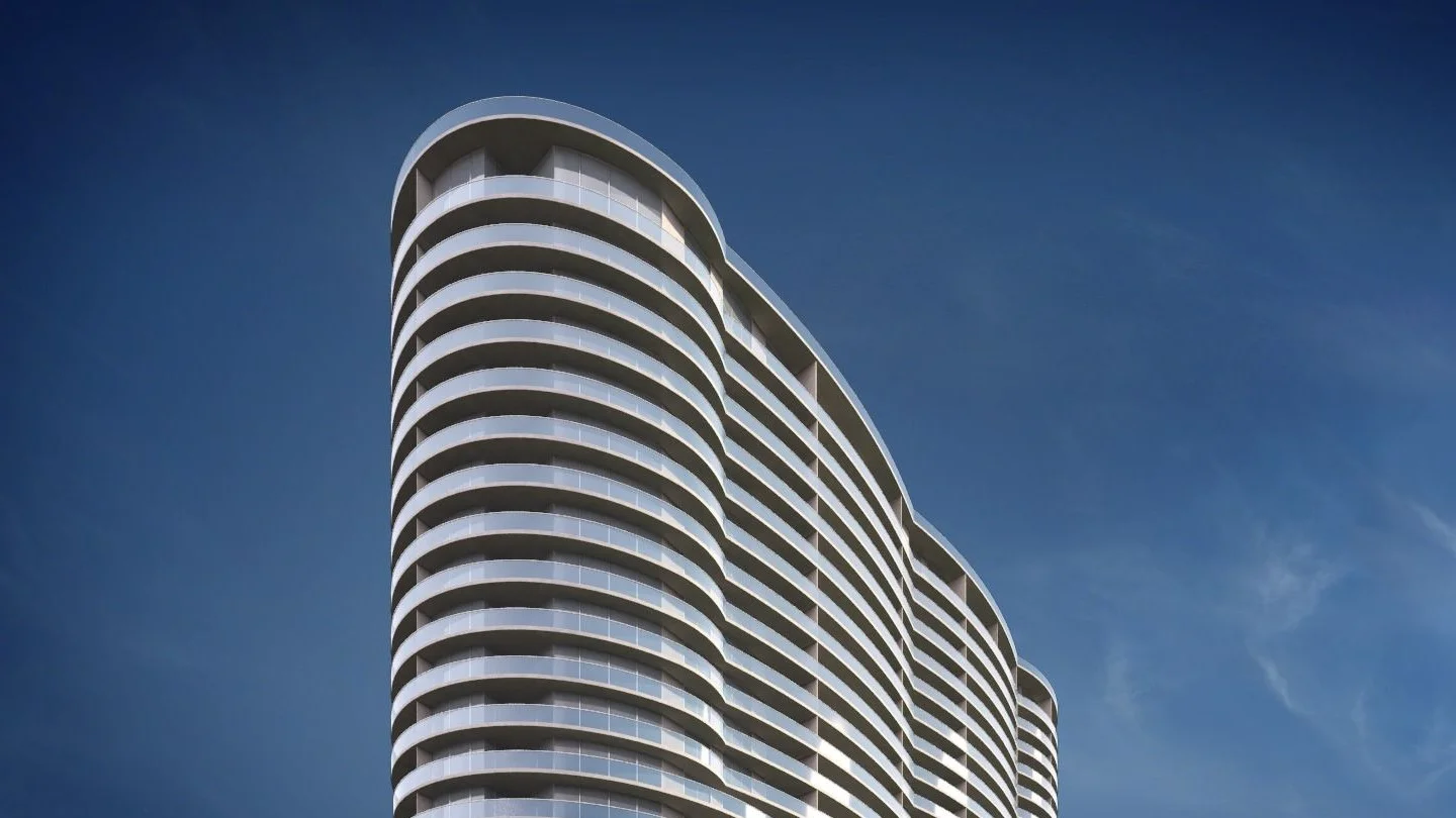 Rendering of the Aria on the Bay tower, with rounded balconies wrapping its curved facade, against a deep blue sky.