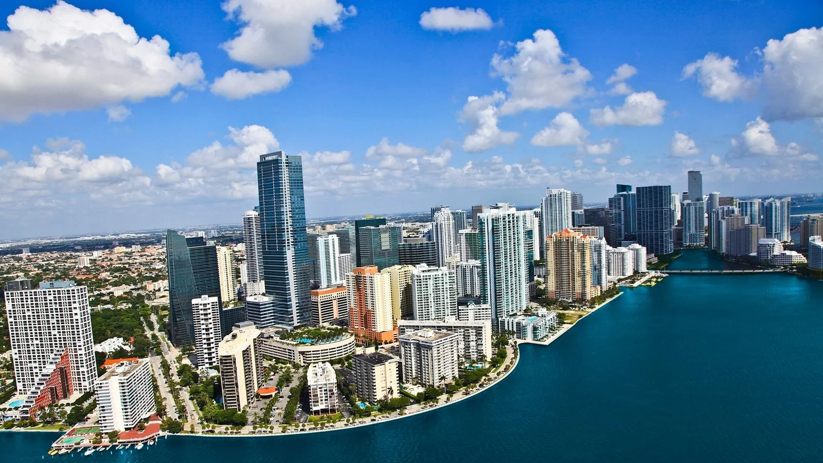 Aerial view of the Brickell neighbourhood in Miami, with high-rise condo towers along Brickell Bay and the Miami River.