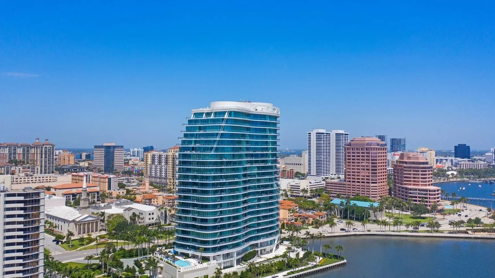 Aerial view of The Bristol tower on the Intracoastal in West Palm Beach, with Palm Beach across the water