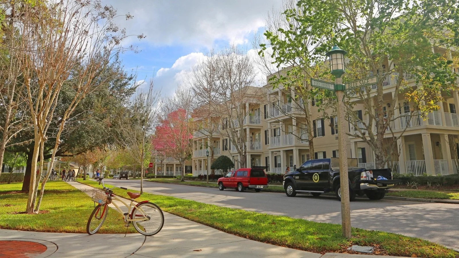 Tree-lined residential street with three-story townhouses in Celebration, Osceola County, an area photo shown in place of Buenaventura Lakes itself.