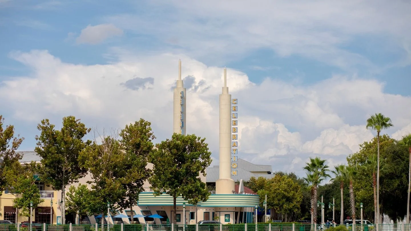 Twin spires of the landmark town center building rising above the trees in Celebration, Florida.