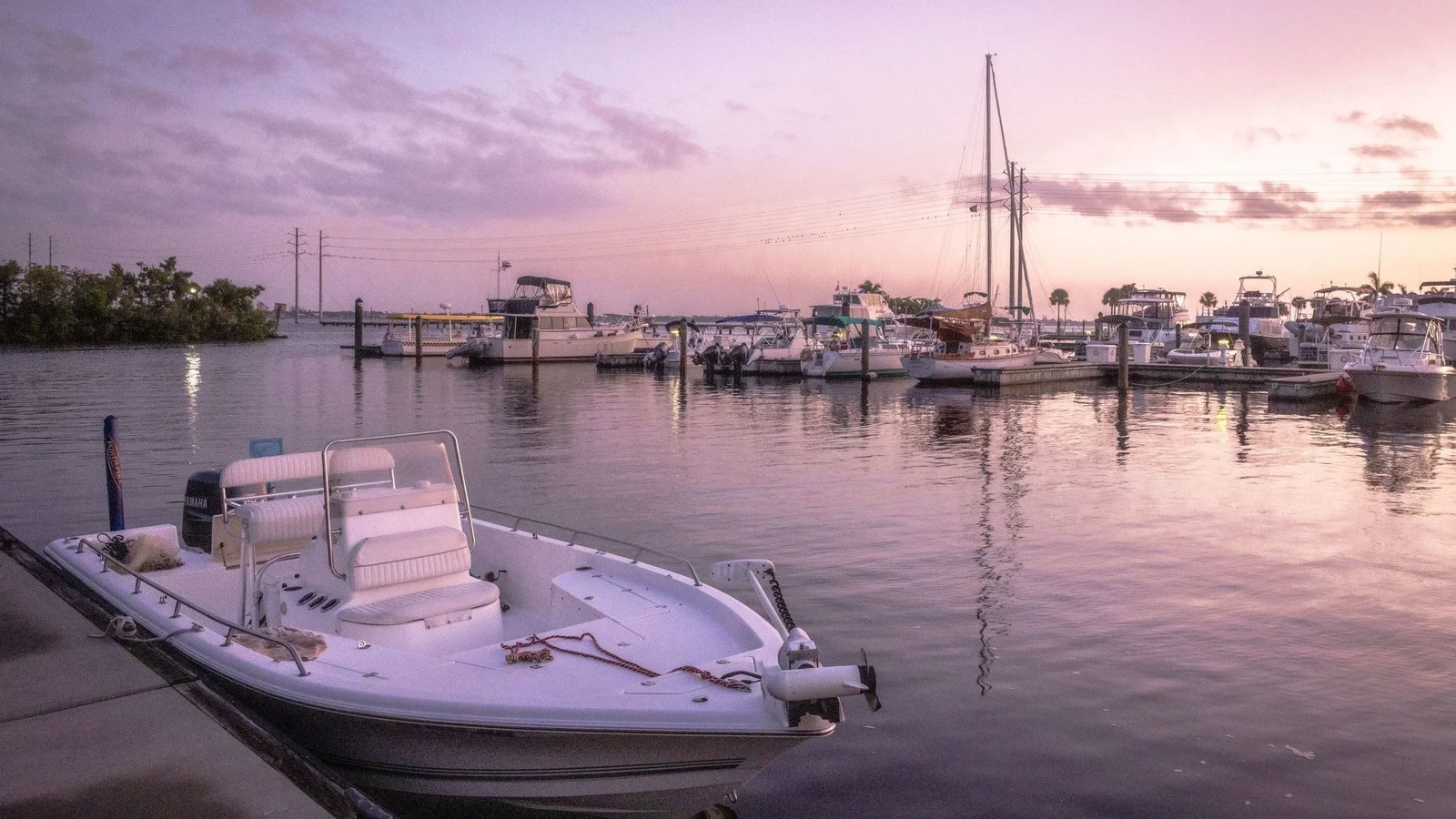 Boats moored at Laishley Park marina in Punta Gorda at dusk