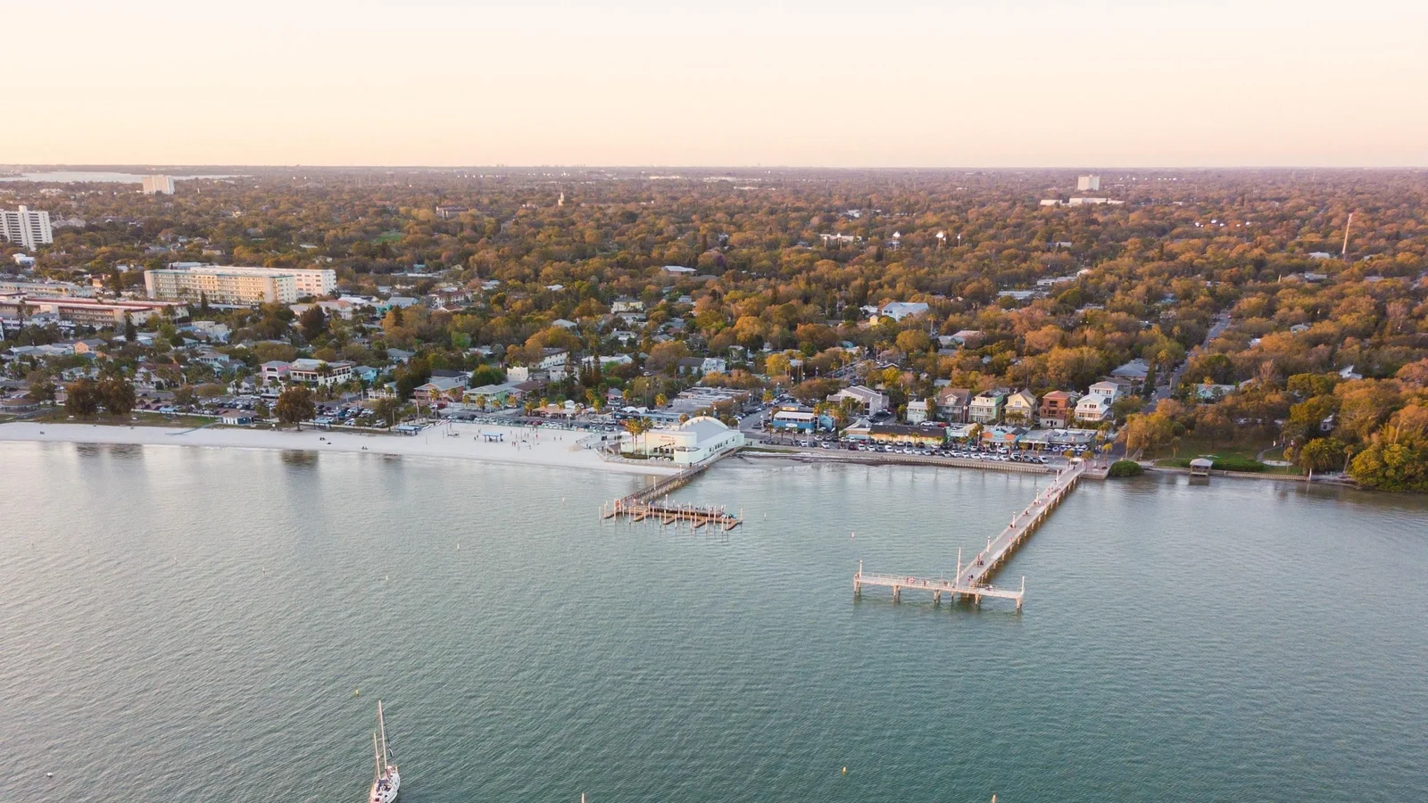 Aerial view of the Gulfport waterfront, piers and tree-lined neighborhoods near St. Petersburg.