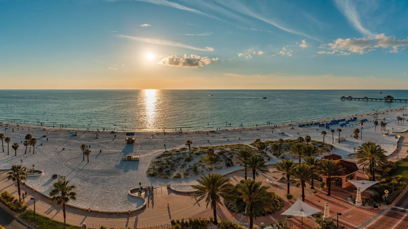 Clearwater Beach at sunset with Pier 60 and the dunes seen from above