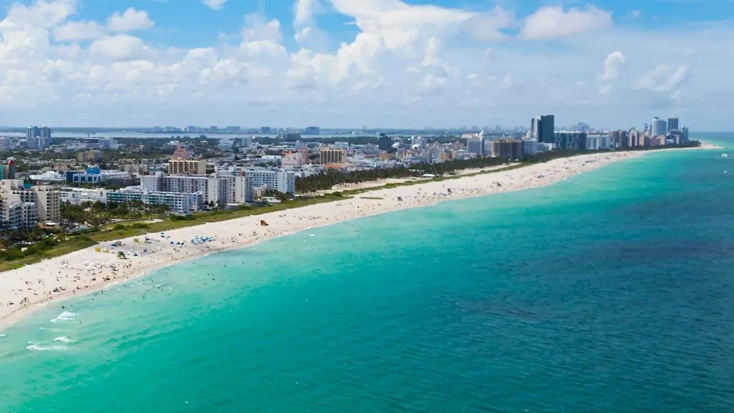 Aerial view of South Beach in Miami Beach with apartment buildings along the shore