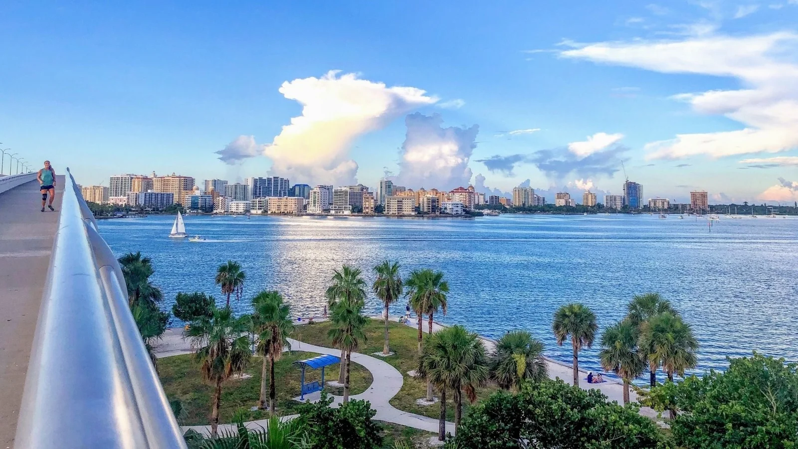 Sarasota Bay and the downtown Sarasota skyline seen from a bridge walkway.