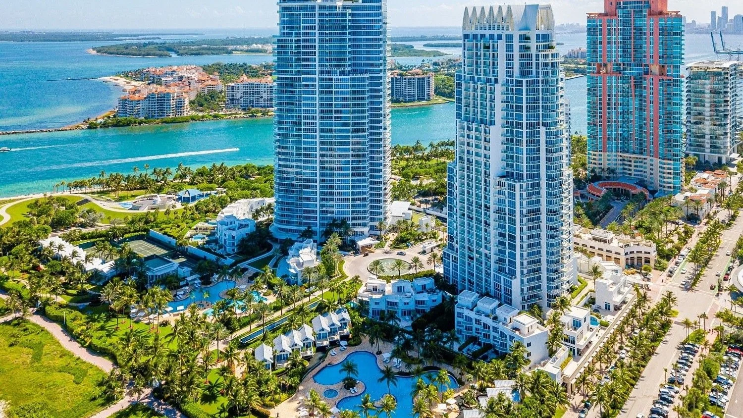 Aerial view of the Continuum towers and gardens at South Pointe, with Government Cut and Fisher Island behind