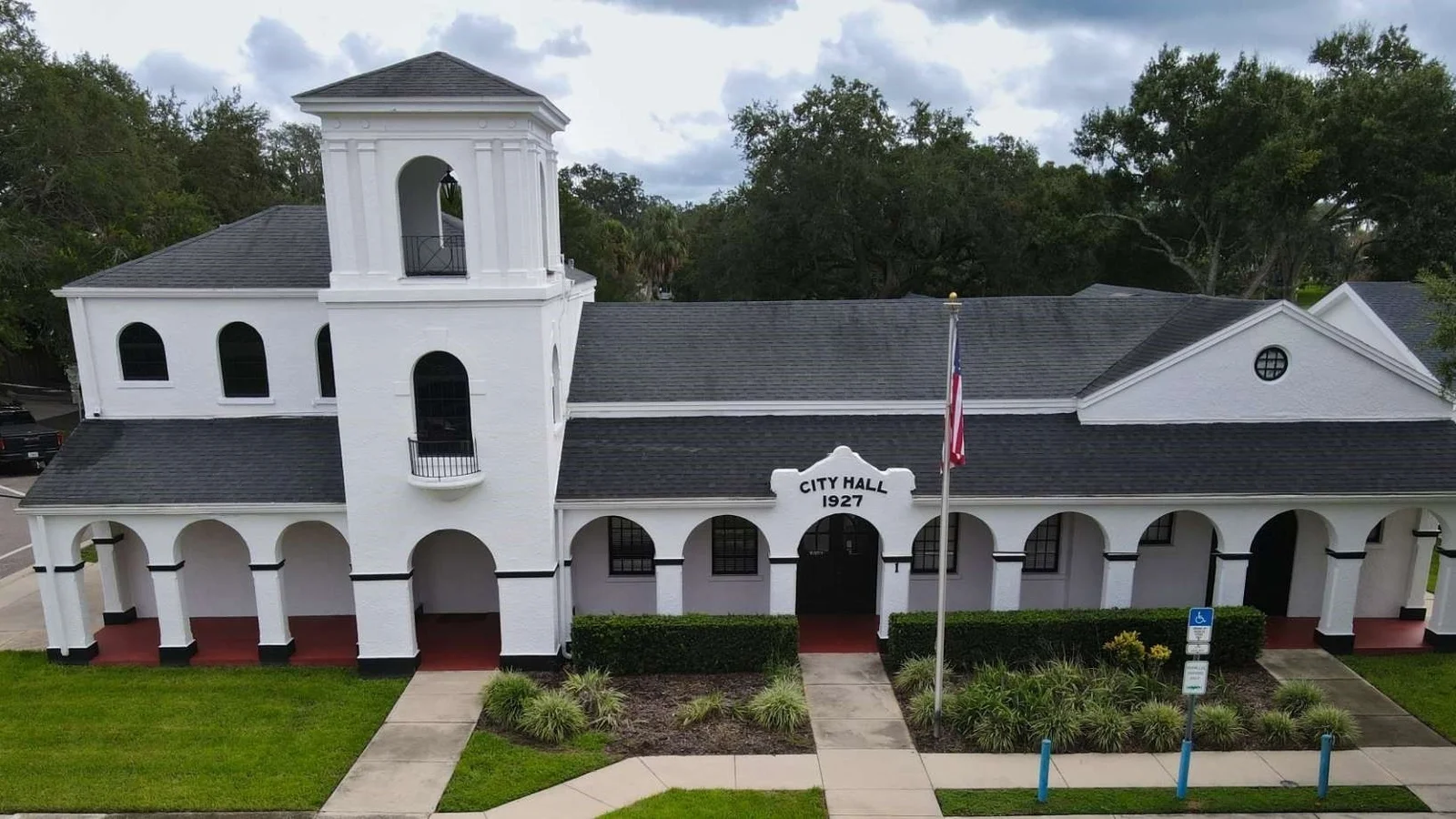 Historic 1927 Davenport City Hall with its white bell tower and arcade.