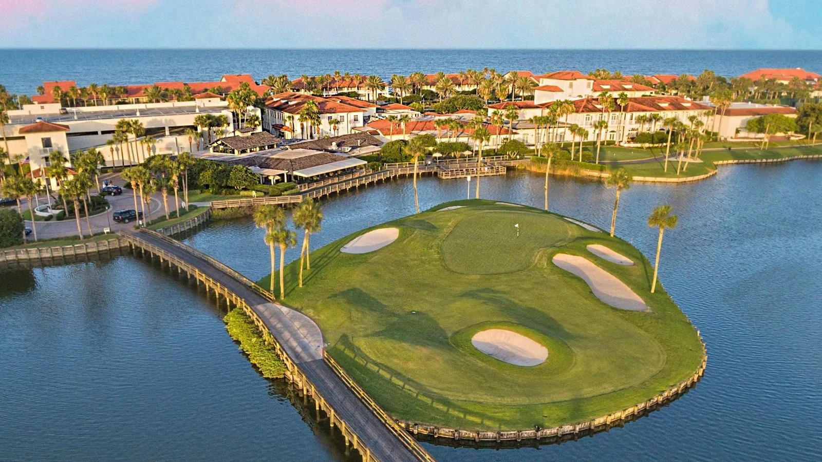Aerial view of the Ponte Vedra Inn and Club golf island green and oceanfront buildings.