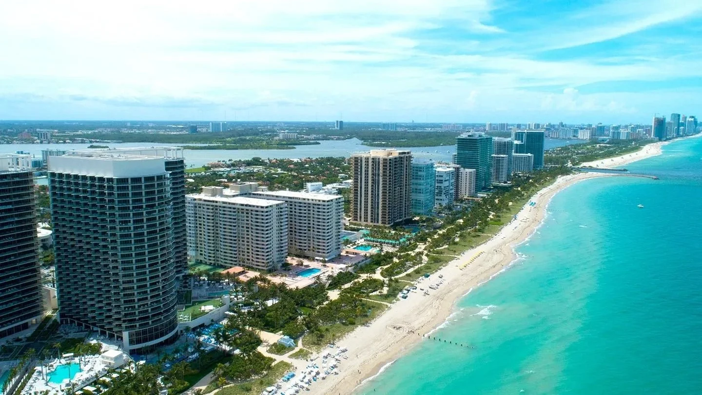 Aerial view of Bal Harbour condo towers along the beach and Haulover Park