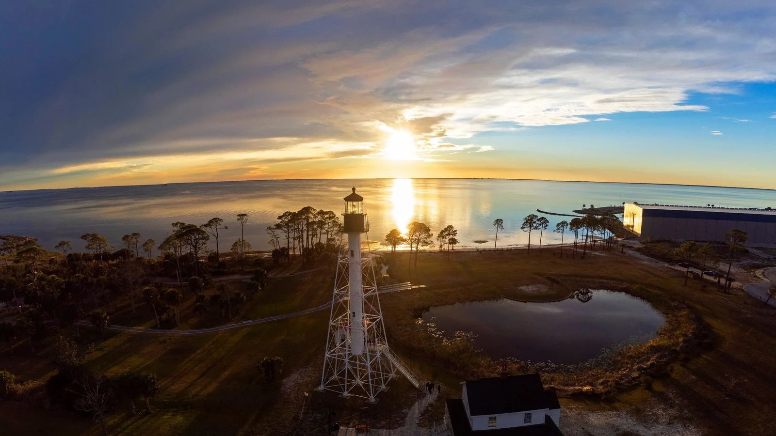 Cape San Blas Lighthouse in Port St. Joe at sunset over St. Joseph Bay