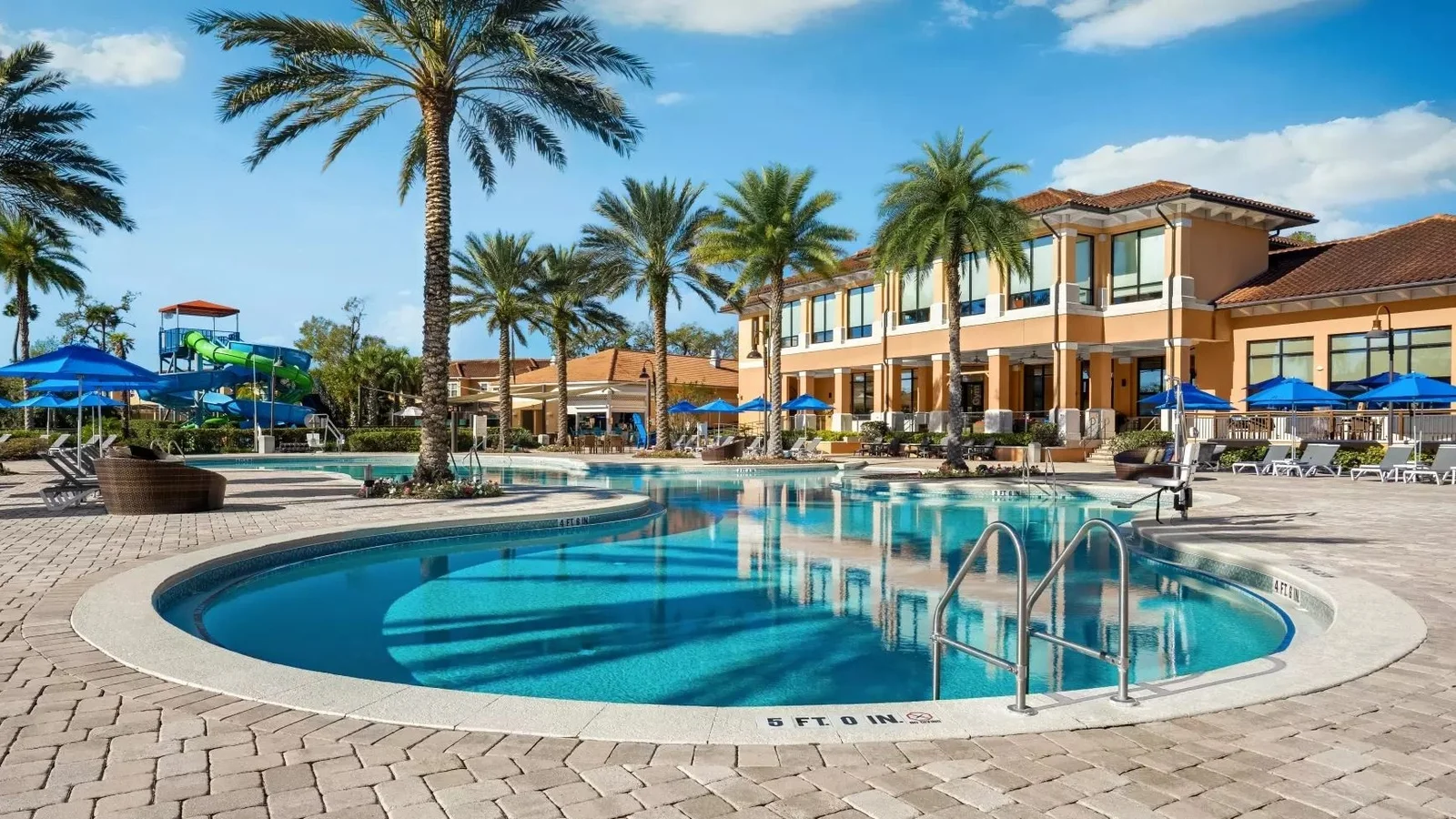 Resort pool and clubhouse at Regal Oaks, a vacation townhome resort in Kissimmee.