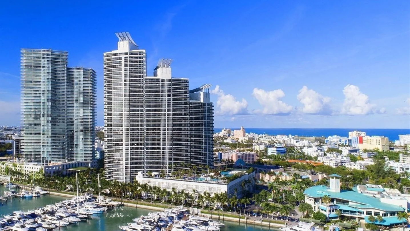 Murano Grande towers stepping down beside the Miami Beach Marina in South of Fifth