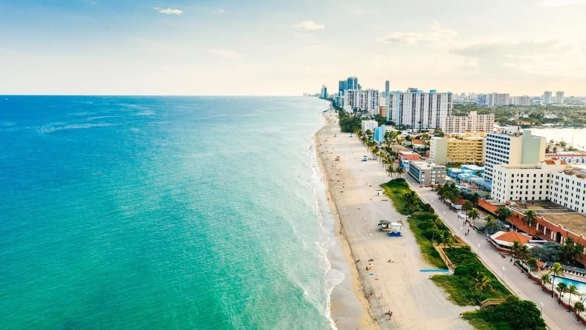 Aerial view of Hollywood Beach and its Broadwalk with hotels and condominiums along the shore; the photo shows the neighbourhood, not the building itself