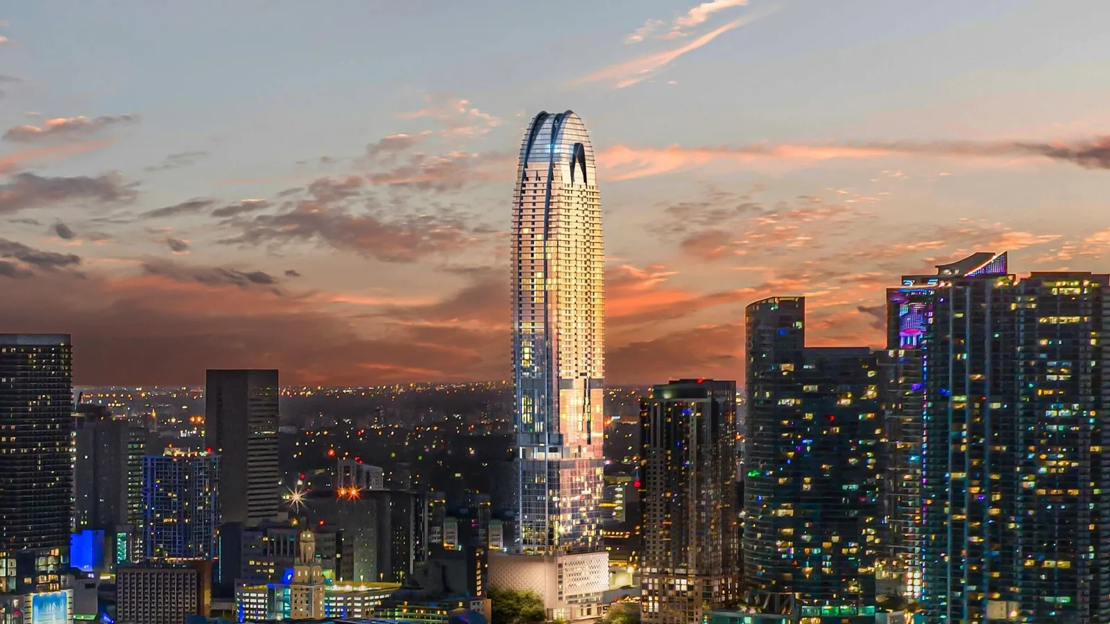 Rendering of the Okan Tower lit up at sunset with its curved crown, rising above the Downtown Miami skyline.