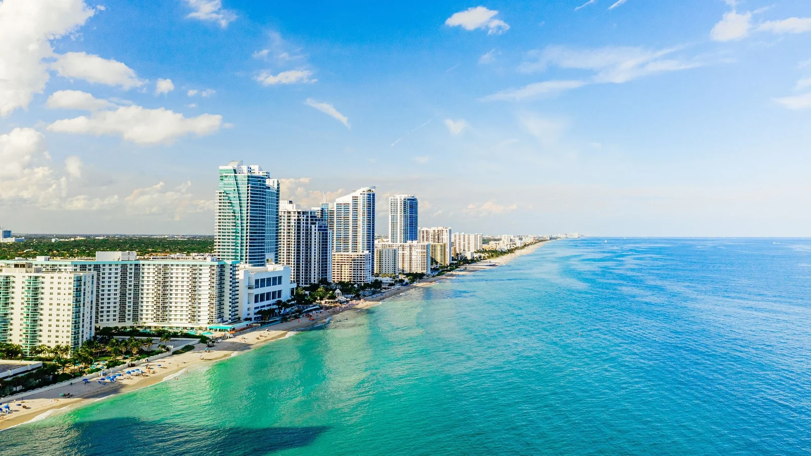 Aerial view of Hallandale Beach condo towers along the Atlantic shore