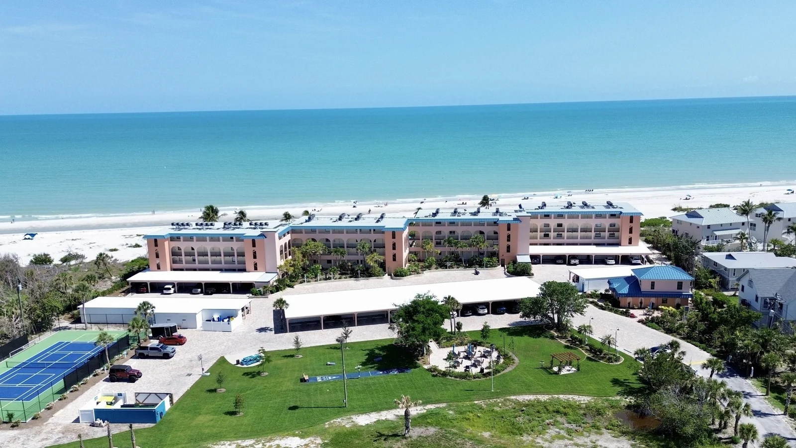 Aerial view of a low-rise beachfront condominium resort on Sanibel Island, Florida.