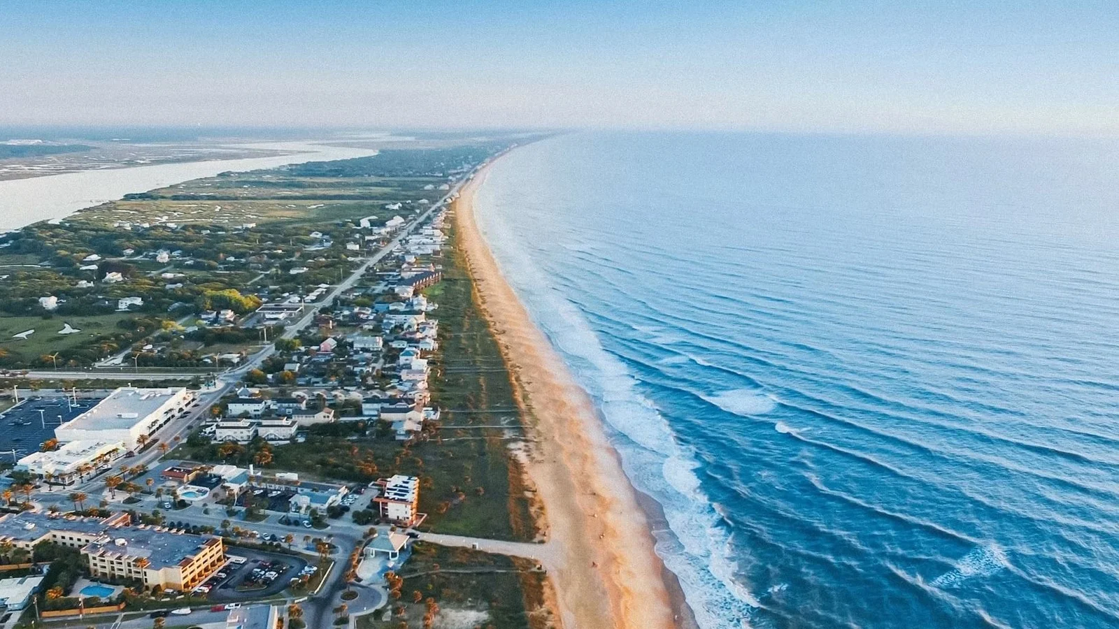 Aerial view of a barrier island beach town and the Atlantic shore at St. Augustine Beach.