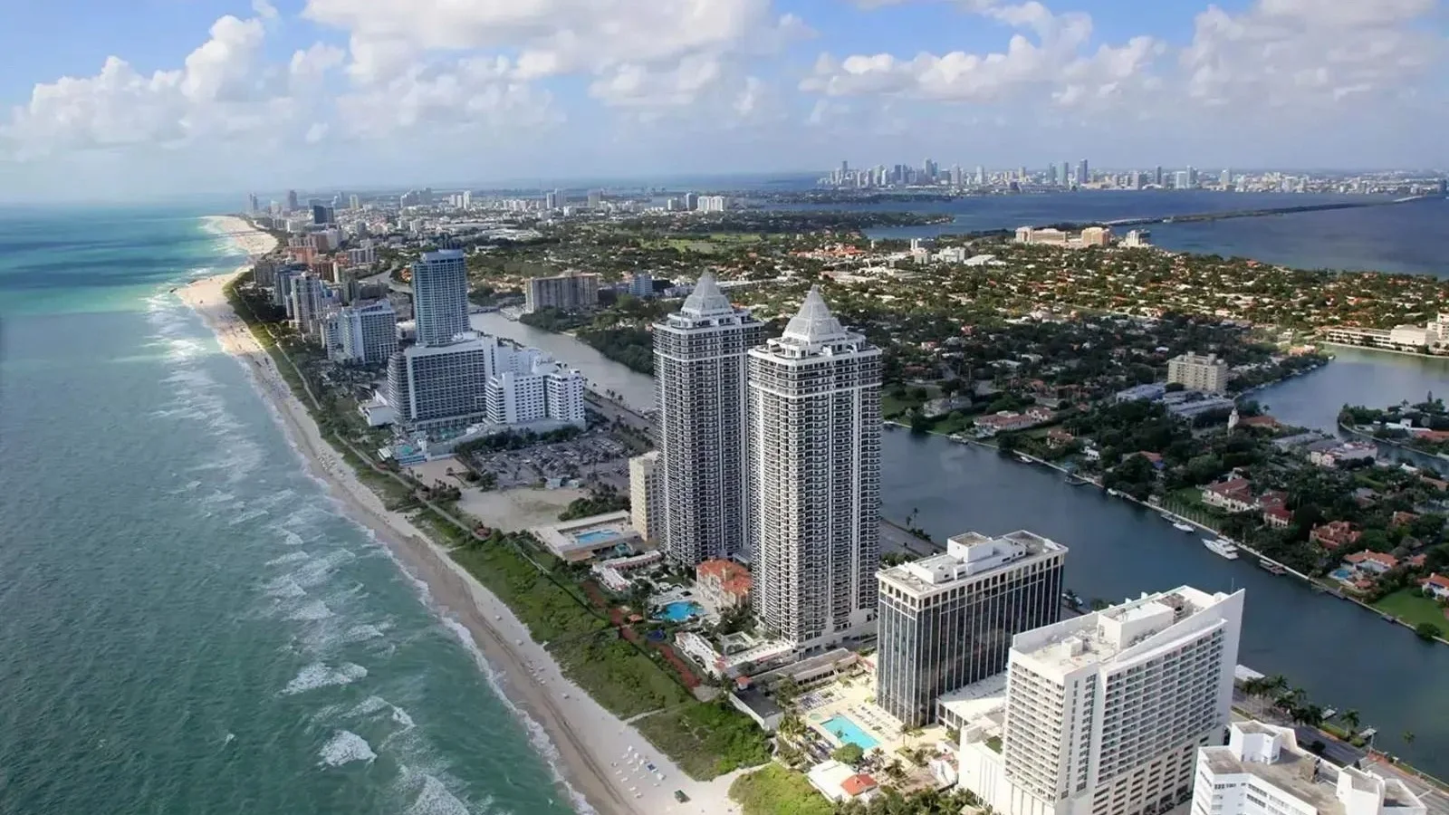 Aerial view of Mid-Beach in Miami Beach with oceanfront towers and Indian Creek; the photo shows the neighbourhood, not Tower 41 itself