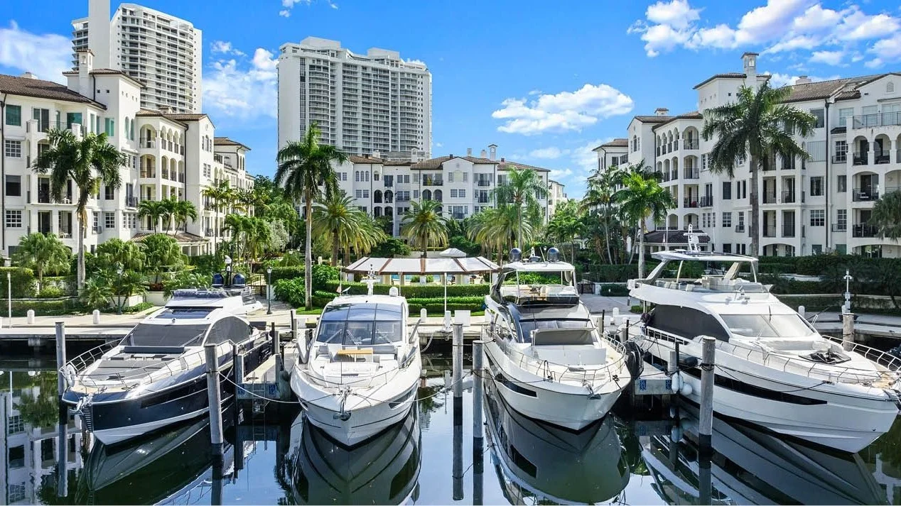 Yachts in the Williams Island marina in front of the island's condominium buildings in Aventura