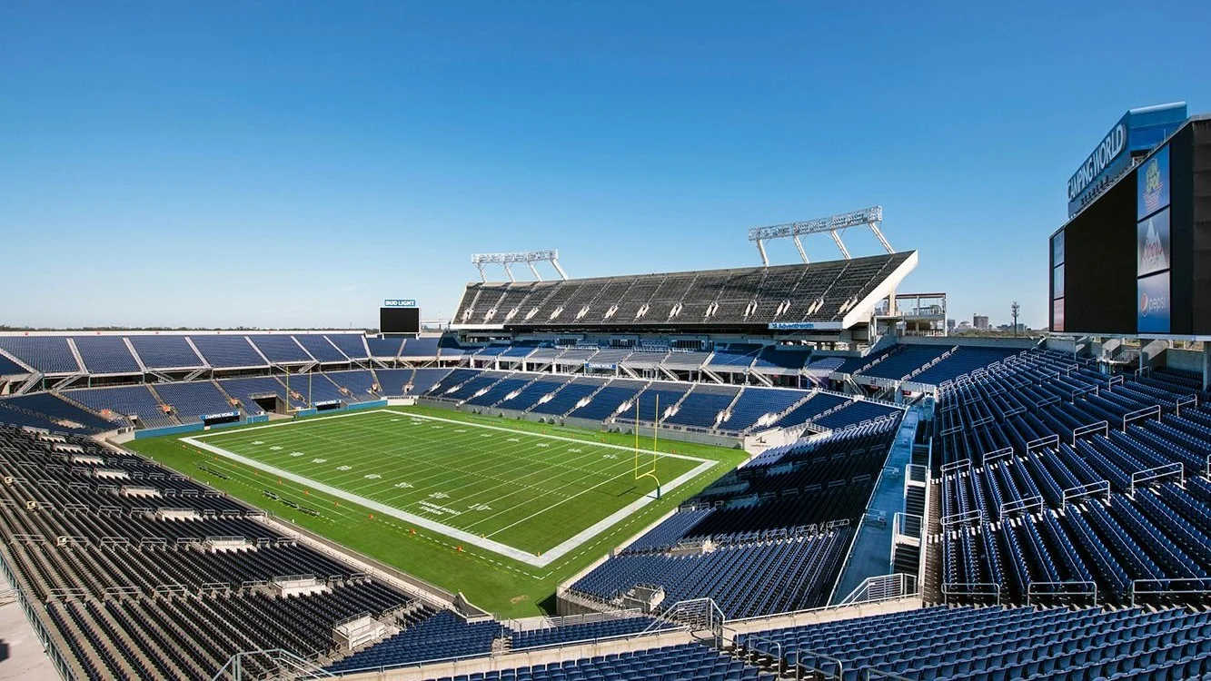 Empty stands and football field inside Camping World Stadium in Orlando.