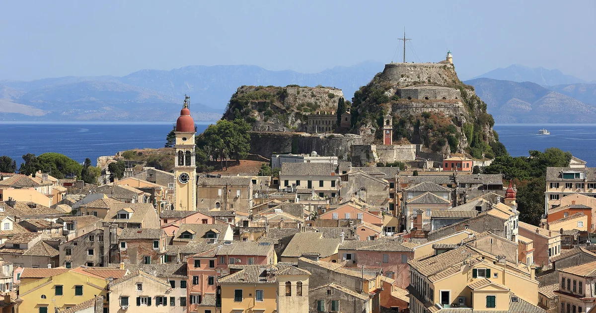 The old fortress rising above the rooftops and bell towers of Corfu Town