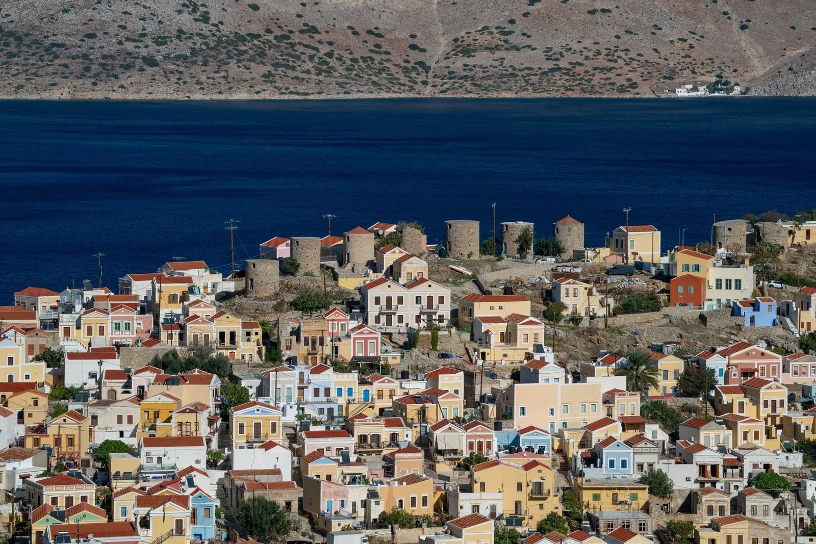 Colourful hillside houses of Symi town
