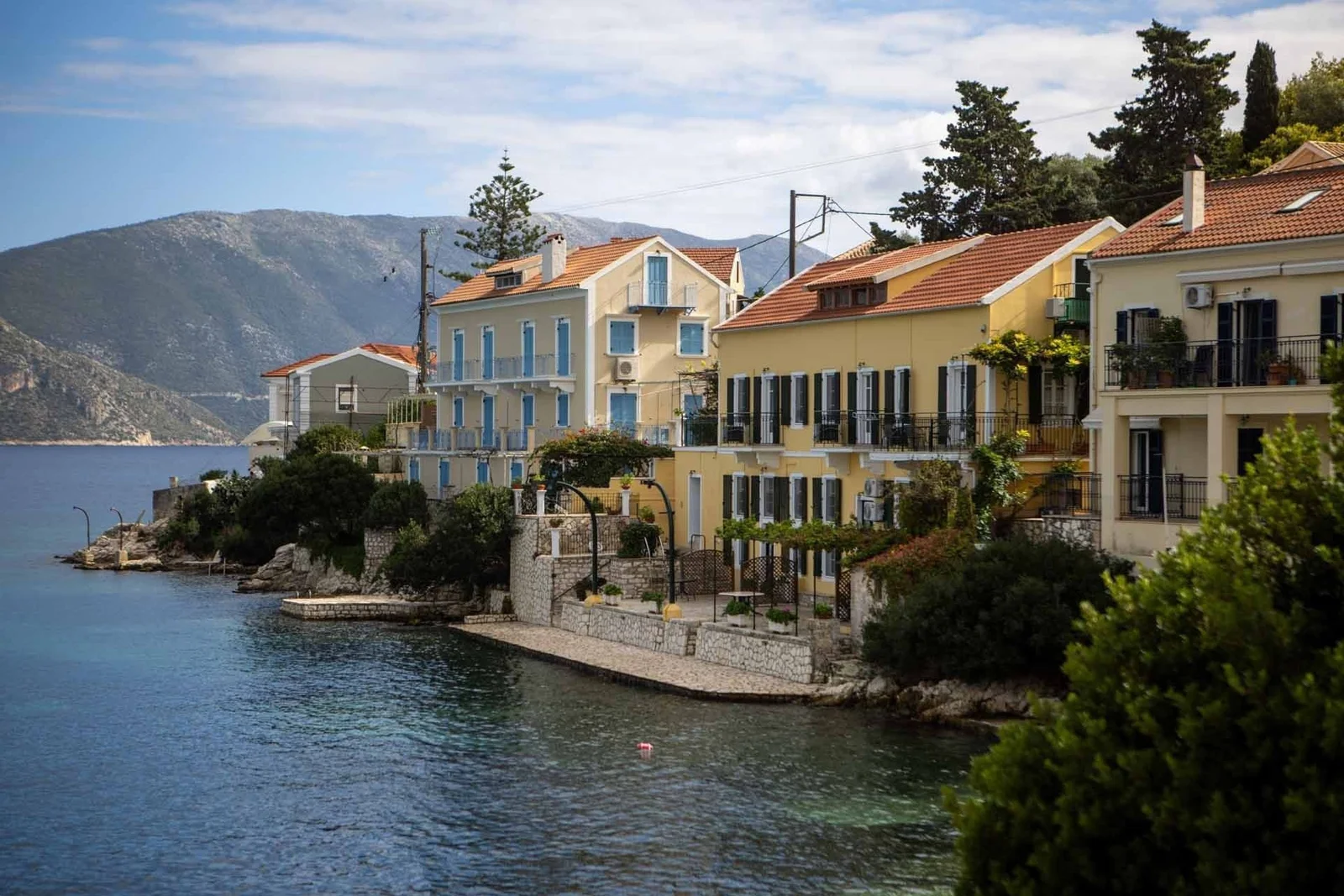Pastel waterfront houses in a Kefalonia village