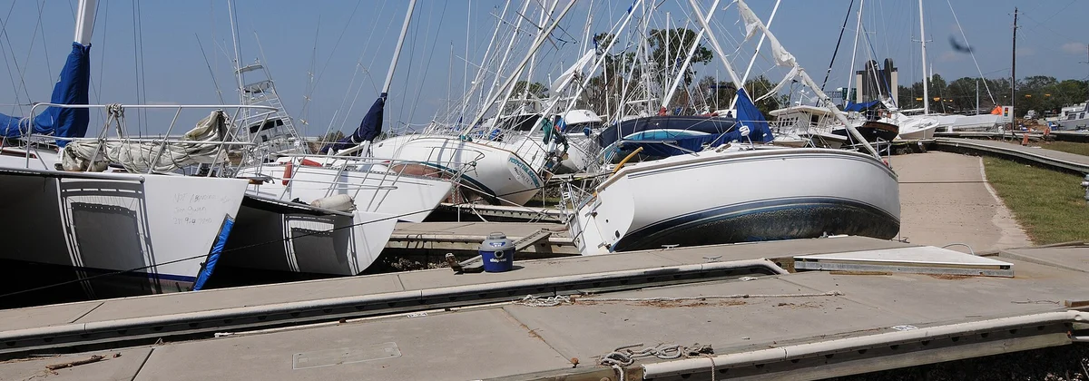 Boats pushed ashore and damaged by a hurricane