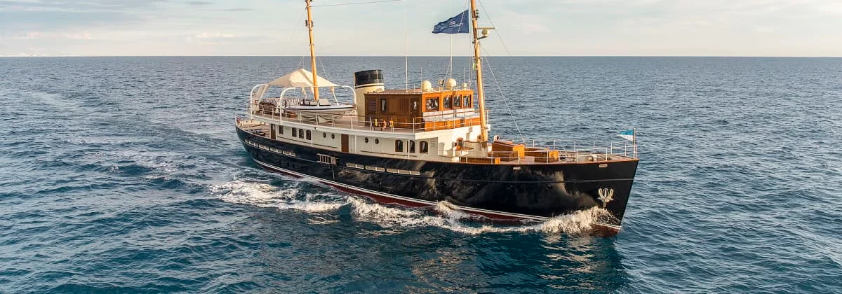 A classic motor yacht under way on open water
