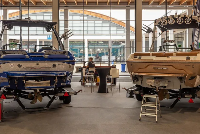 Wakeboard boats on display at a boat show