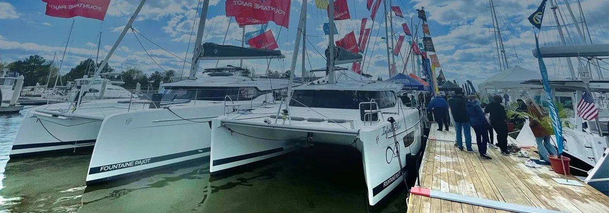 Catamarans and visitors on the docks of the Annapolis boat show