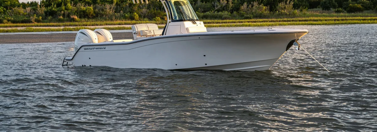 Grady-White Canyon 266 centre console on a marsh-lined waterway