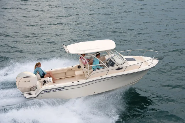 Grady-White Adventure 218 walkaround cabin boat running with a family aboard