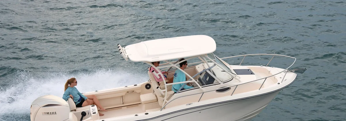 Grady-White Adventure 218 walkaround cabin boat running with a family aboard