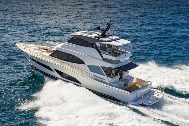 Riviera 64 Sports Motor Yacht with a flybridge running at speed