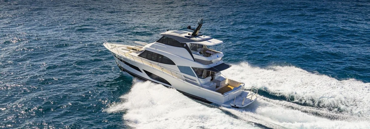 Riviera 64 Sports Motor Yacht with a flybridge running at speed