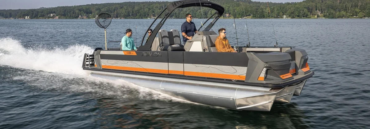 Avalon pontoon boat with an arch running across a lake with passengers