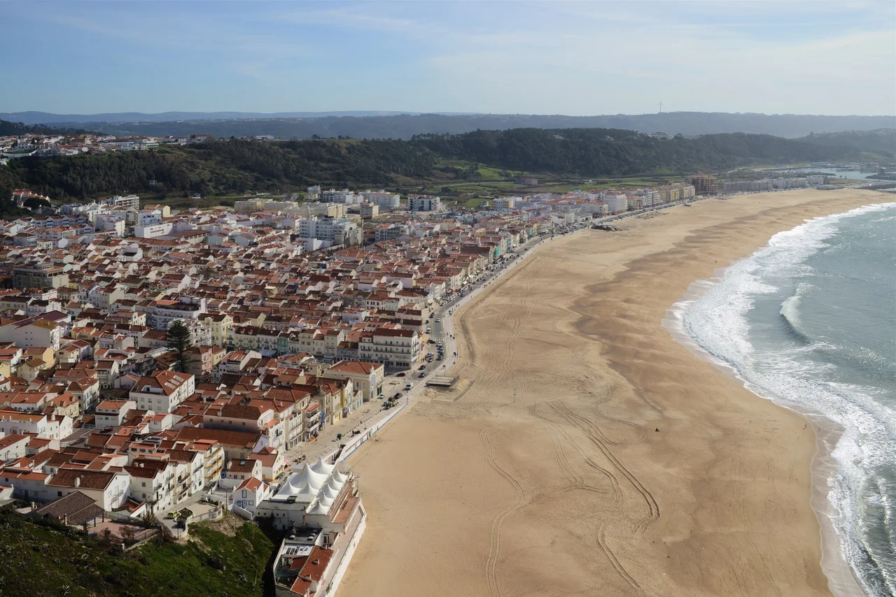 Nazare town and its beach curving north along the Silver Coast