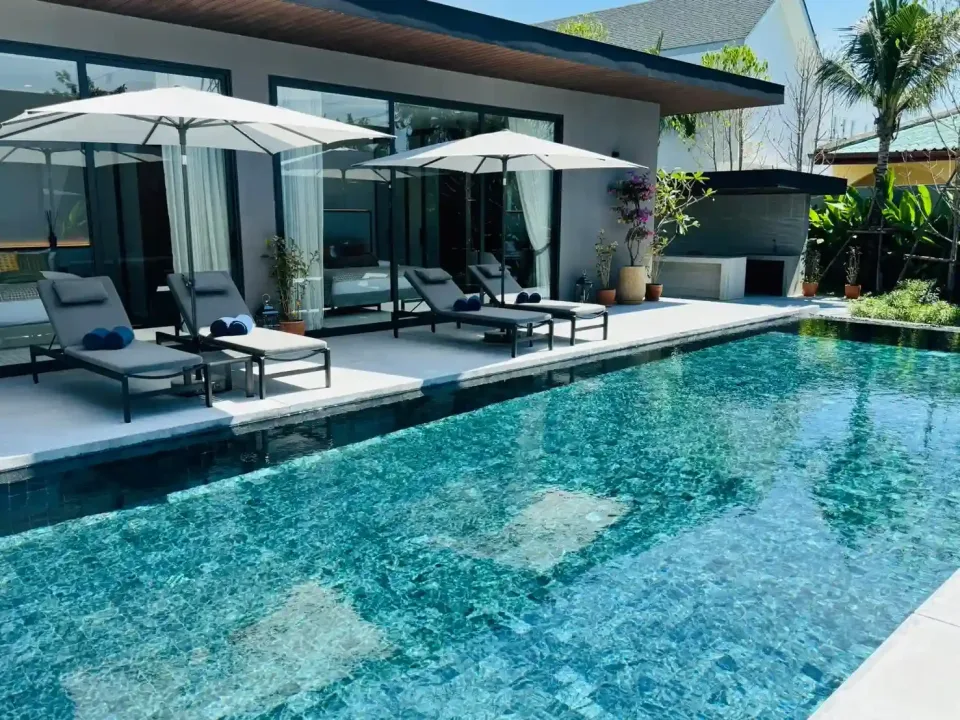 Sea Central villa exterior, completed pool villa with lush landscaping