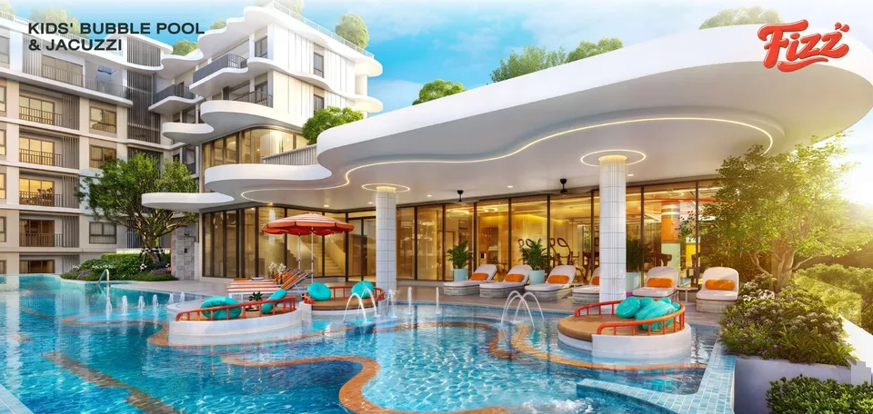 Kids' bubble pool with fountains and a jacuzzi under the curved white canopy of the FIZZ clubhouse