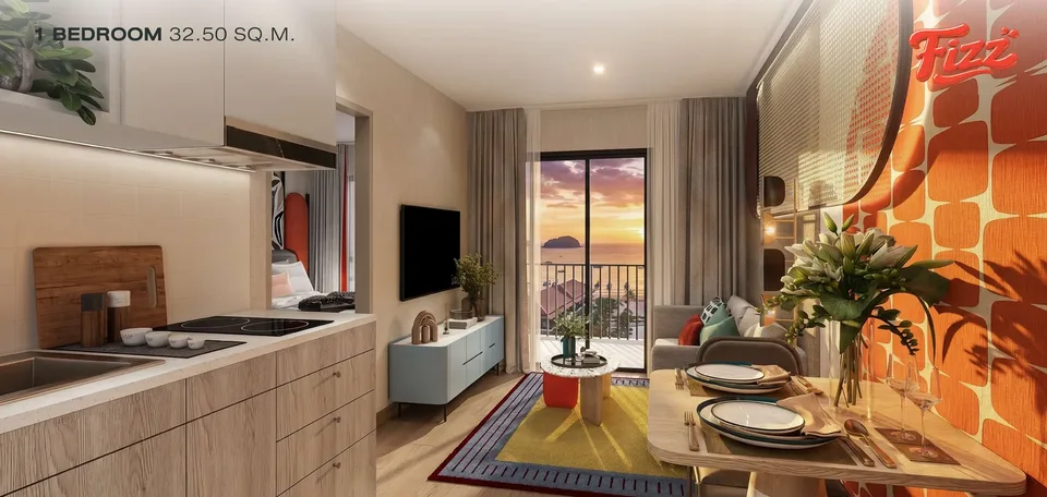 FIZZ one-bedroom of 32.5 sqm with kitchen, living area and balcony door opening to a sunset sea view