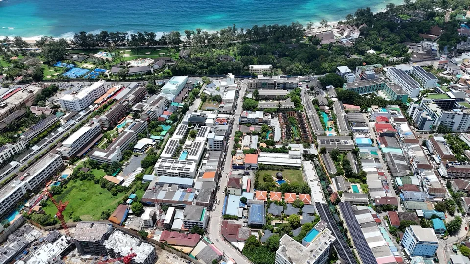 Aerial view over Kata with hotels, streets and the bay, taken in September 2026 around the FIZZ plot