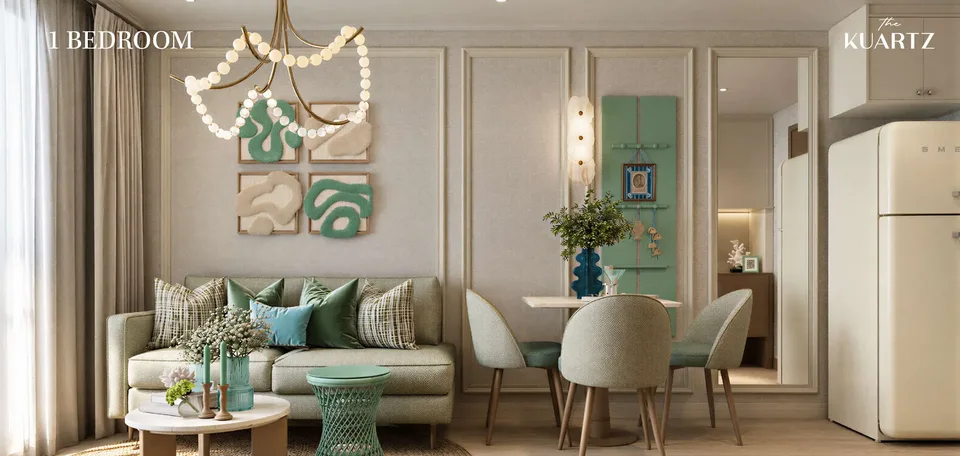 Living and dining area of a KUARTZ one-bedroom apartment in sage green and cream, with a retro fridge