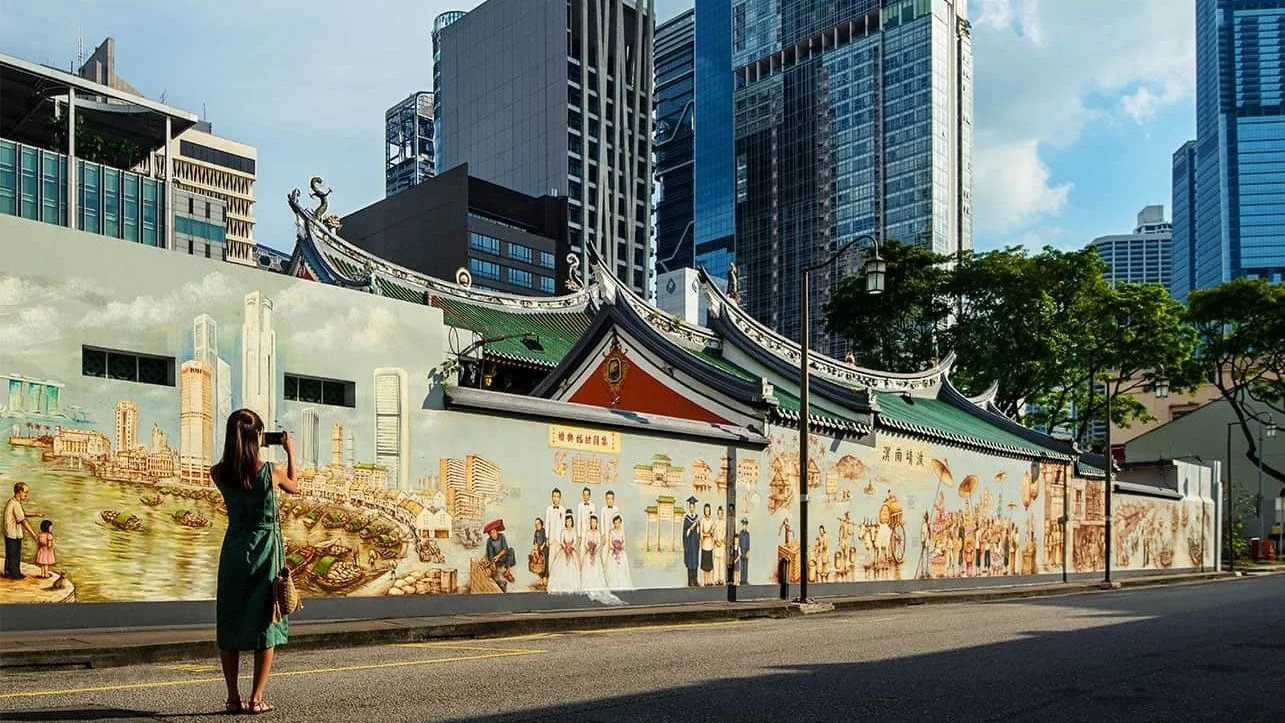 A Chinatown temple wall and the towers behind