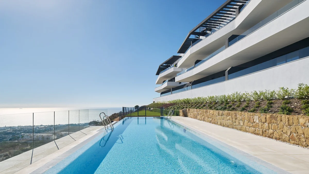 Bali by Kronos Homes in Rincon de la Victoria: communal pool beside the white terraced blocks with sea views