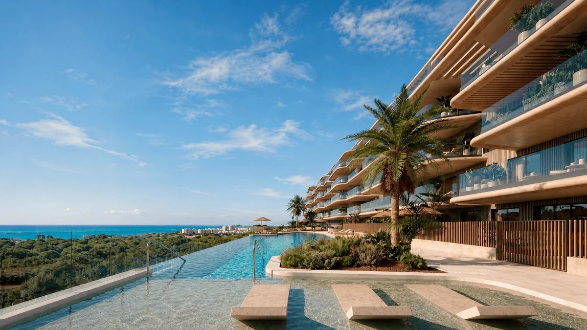 Eklipse by Kronos Homes in Torremolinos: infinity pool and terraced facade overlooking pine woods and the sea
