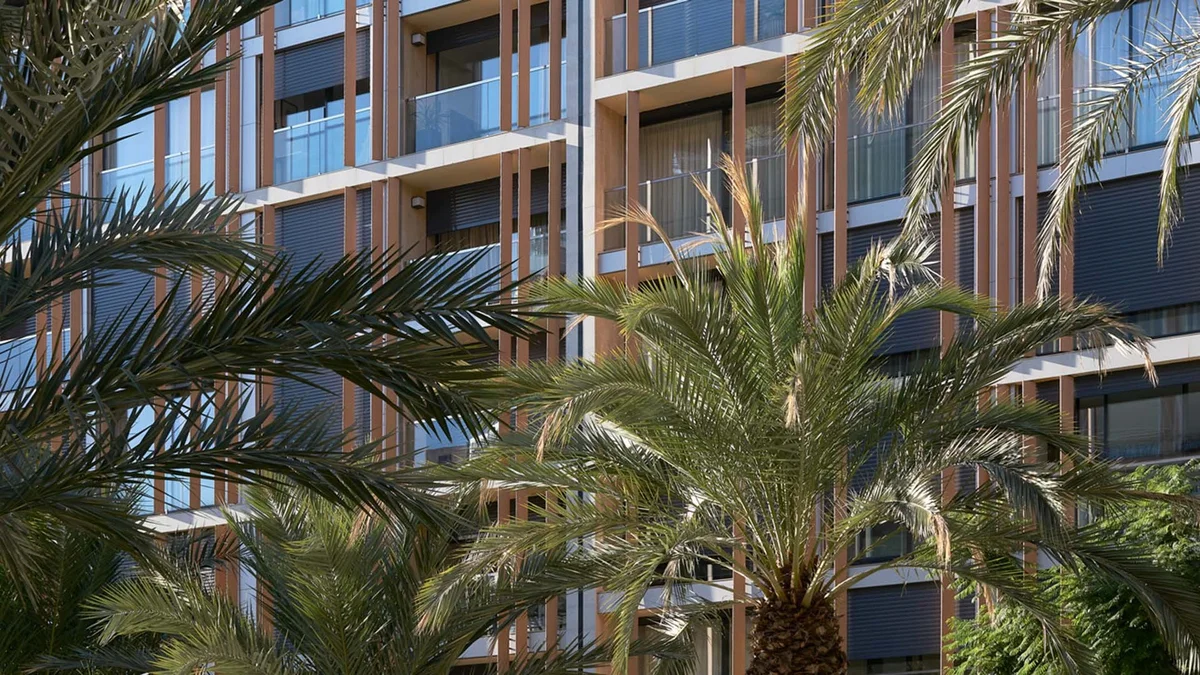 General Marva 3 residential building facade with palm trees in central Alicante