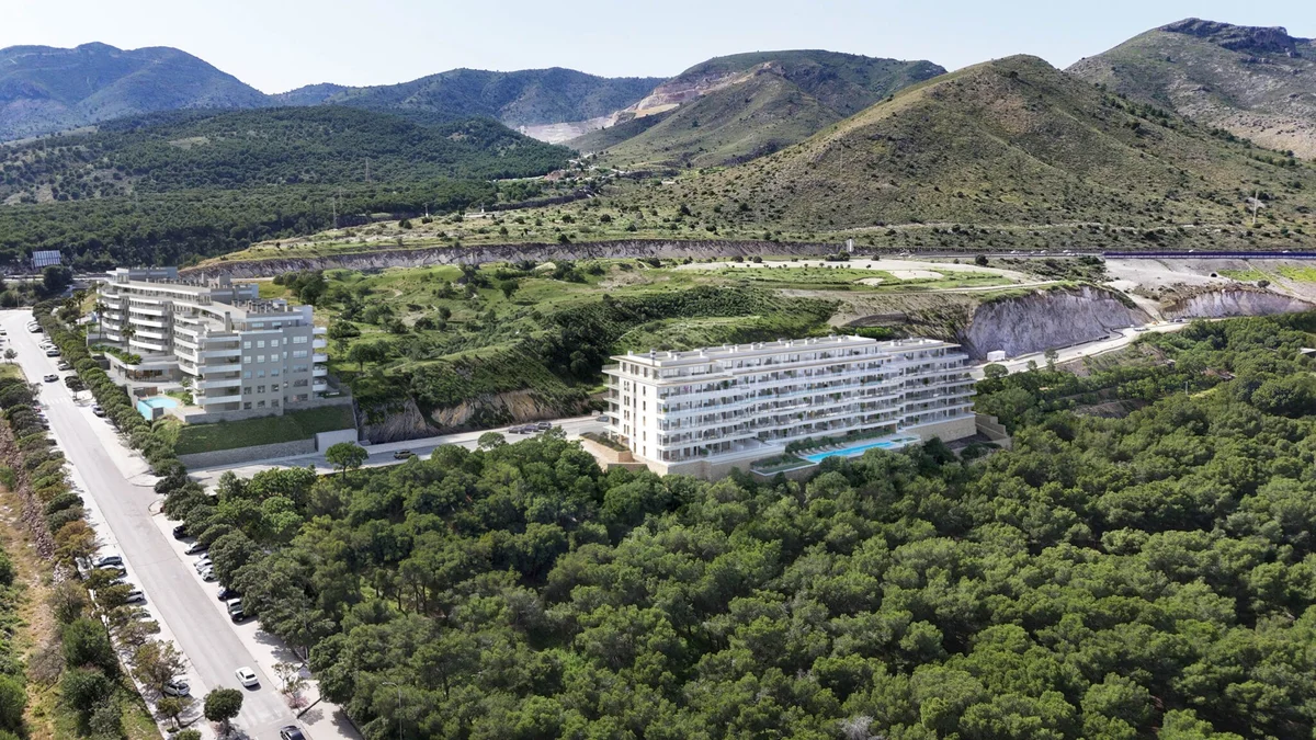 Aerial view of Kronos Homes Kosmos buildings among pine forest, Torremolinos